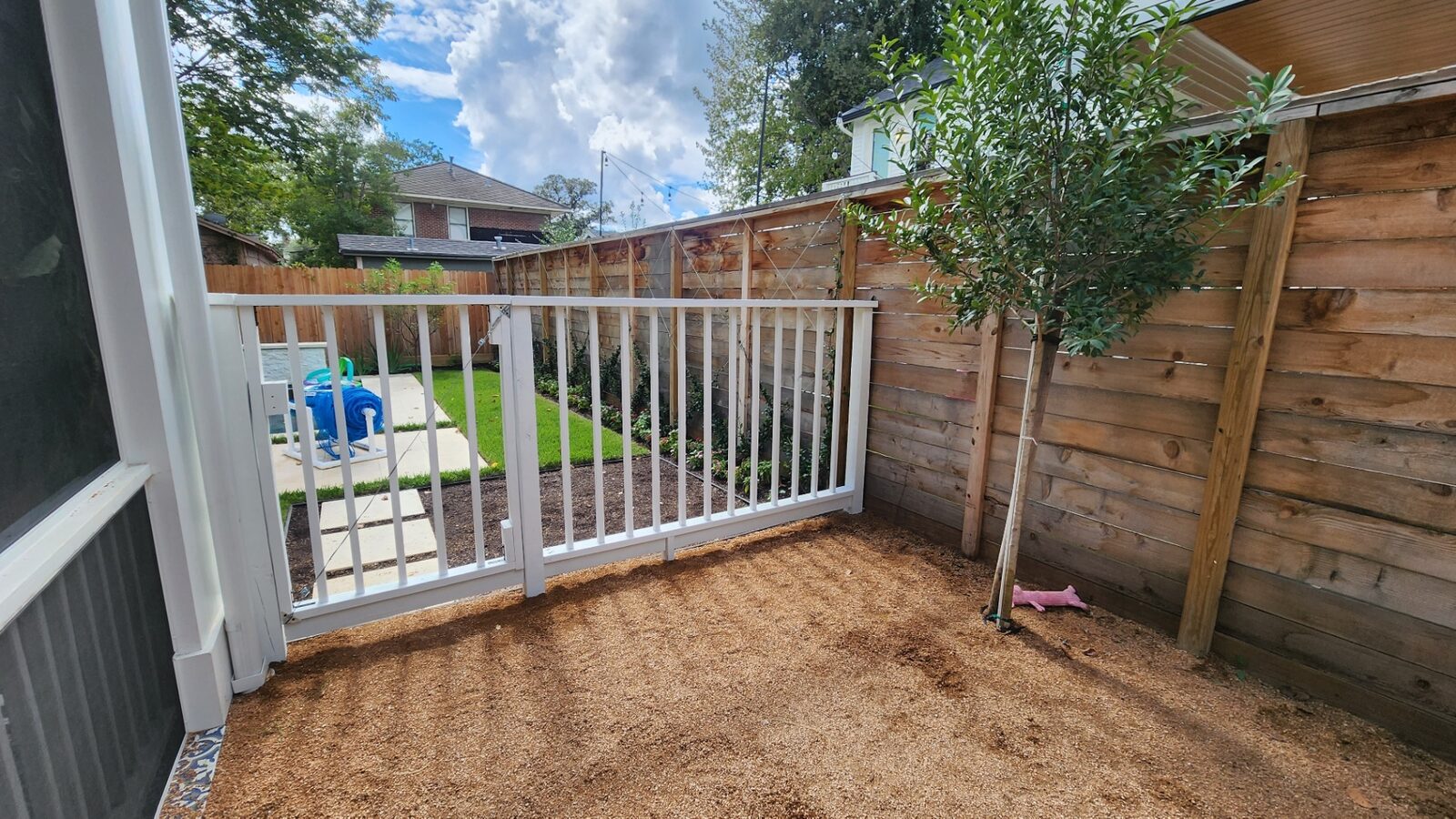 Freshly painted white patio railing and trim work