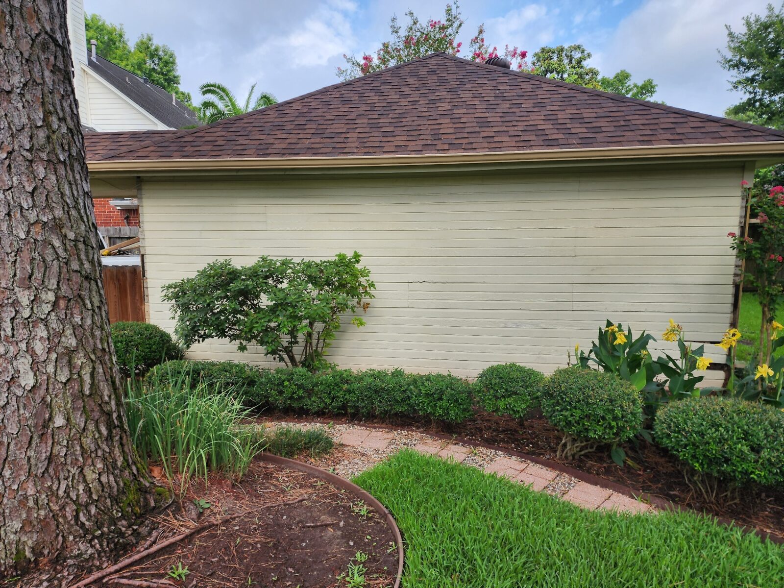 Repainted single story home exterior with clean cream siding